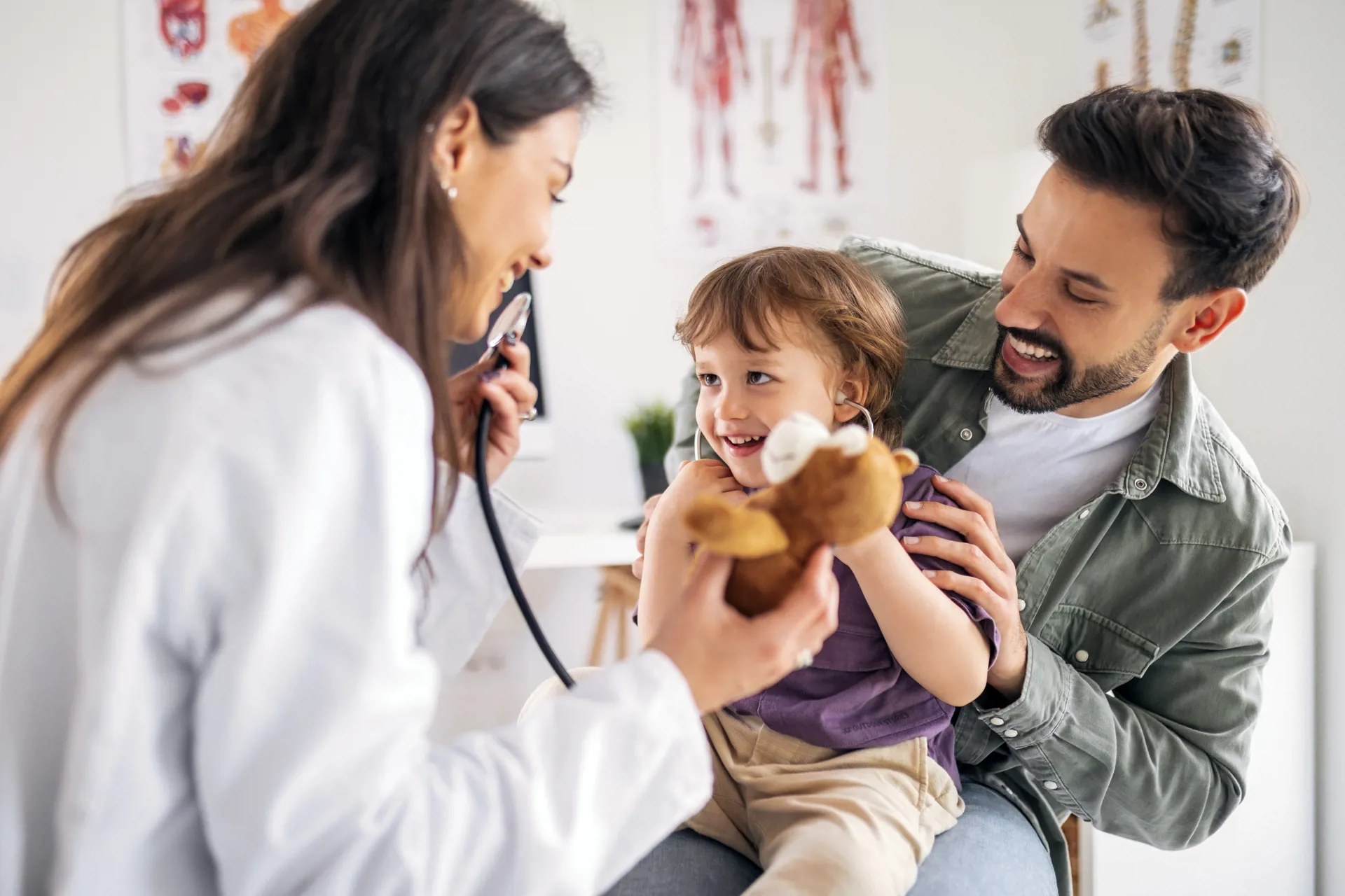 Friendly Doctor Checking Child’s Heartbeat with Stethoscope