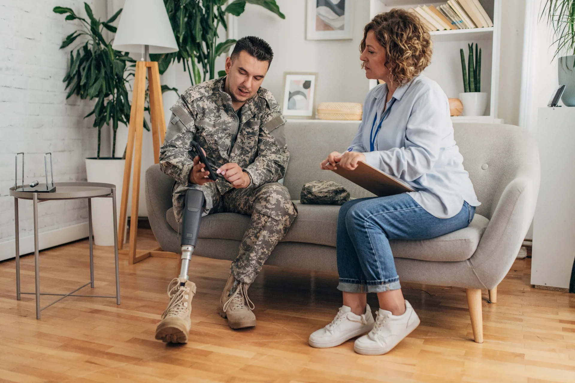 Military therapy session with counselor and prosthetic leg