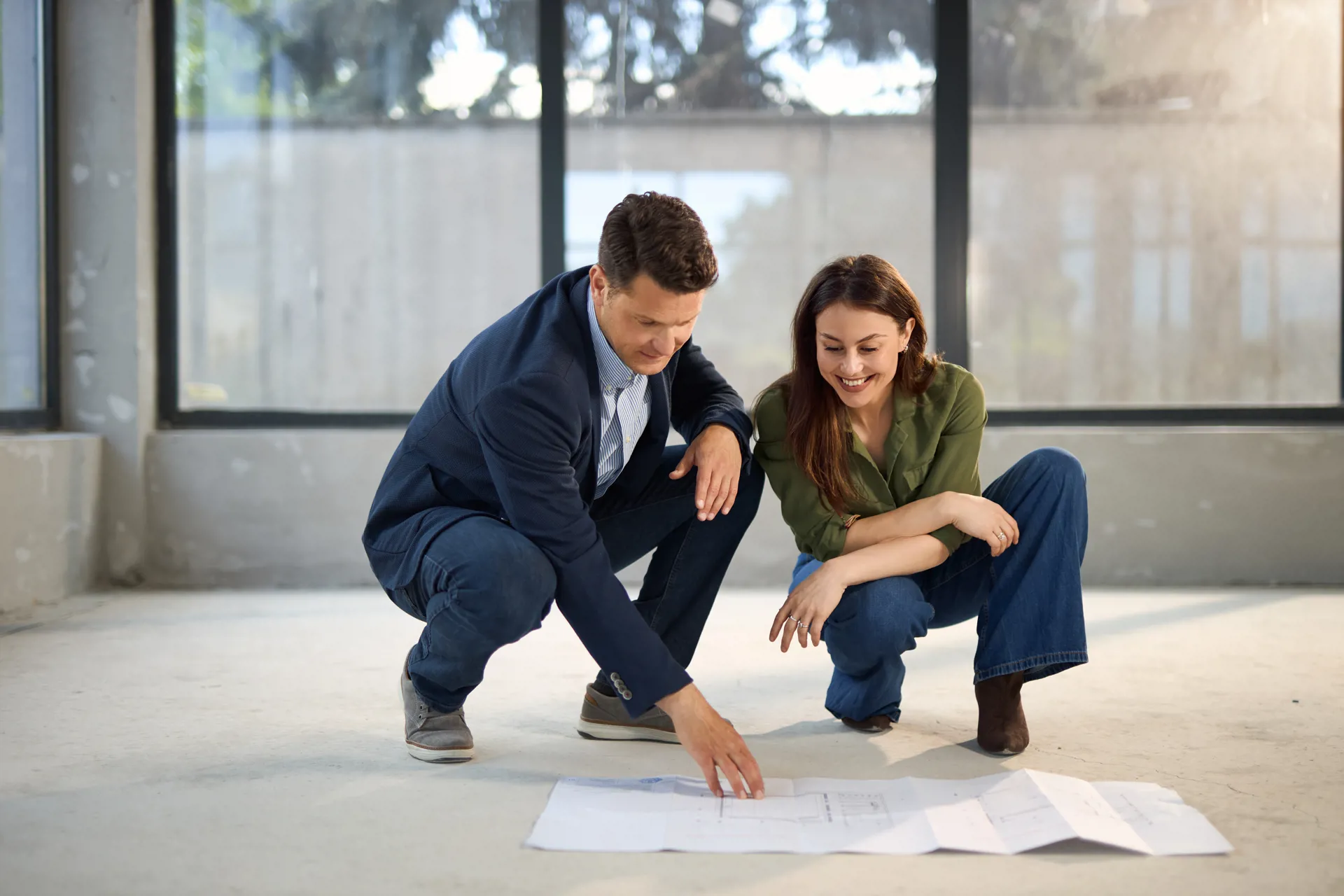 couple looking at home construction blueprint