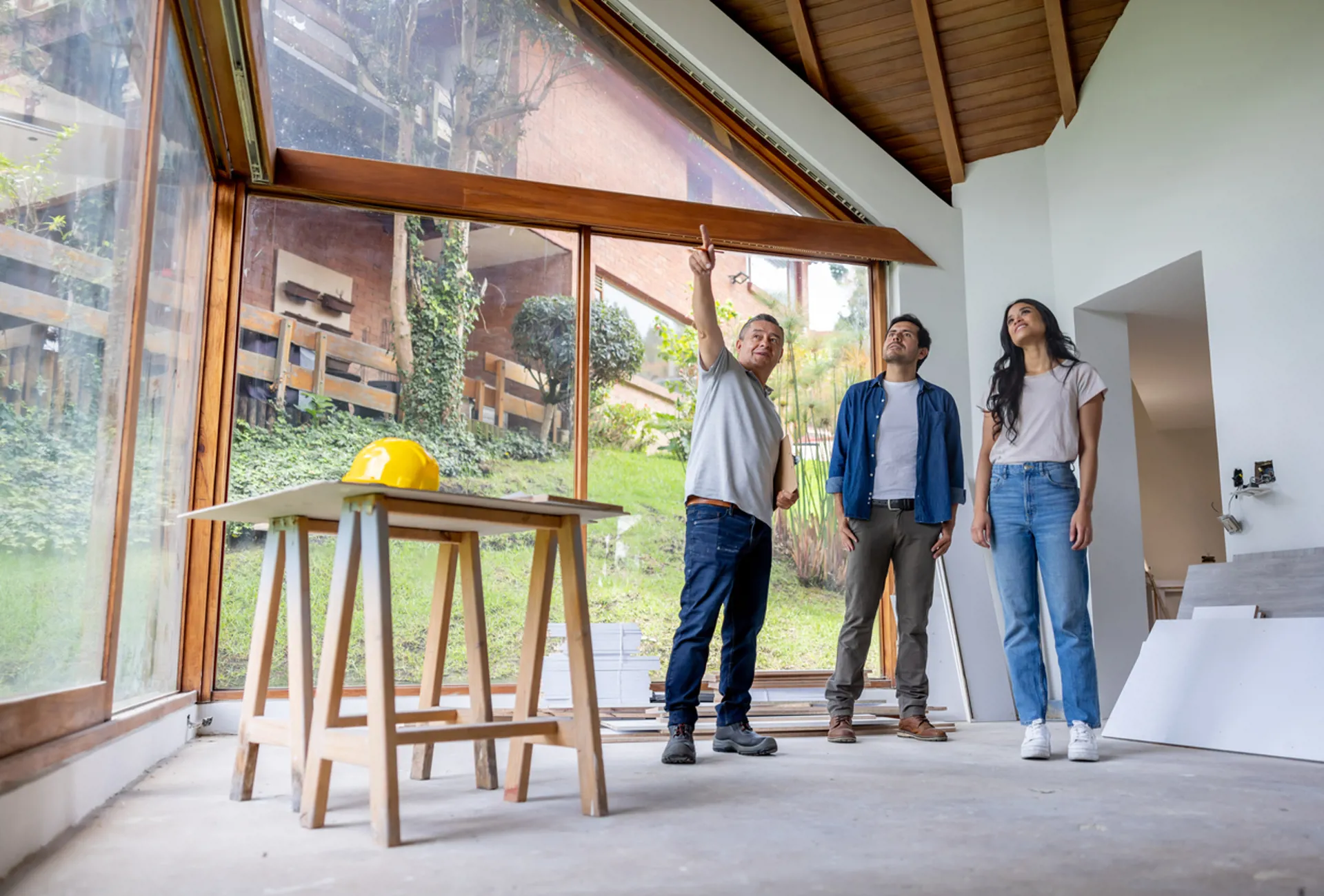 Building contractor talking to clients renovating their house