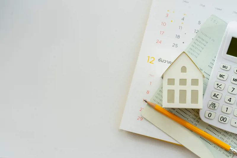 Close up top view group of calculator , home model ,yellow pencil, banking account book and calendar on white color background