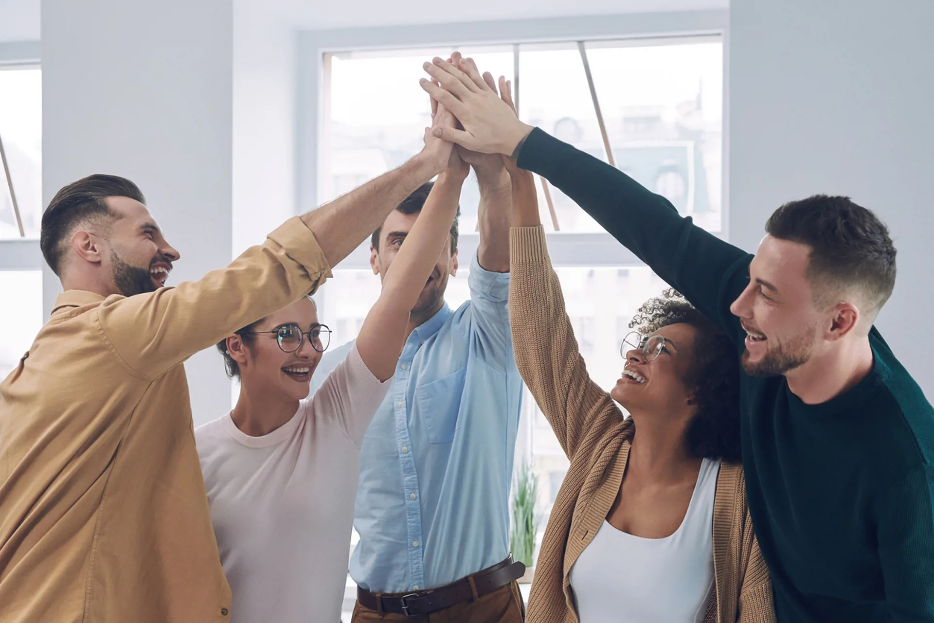 Group of happy young people in smart casual wear