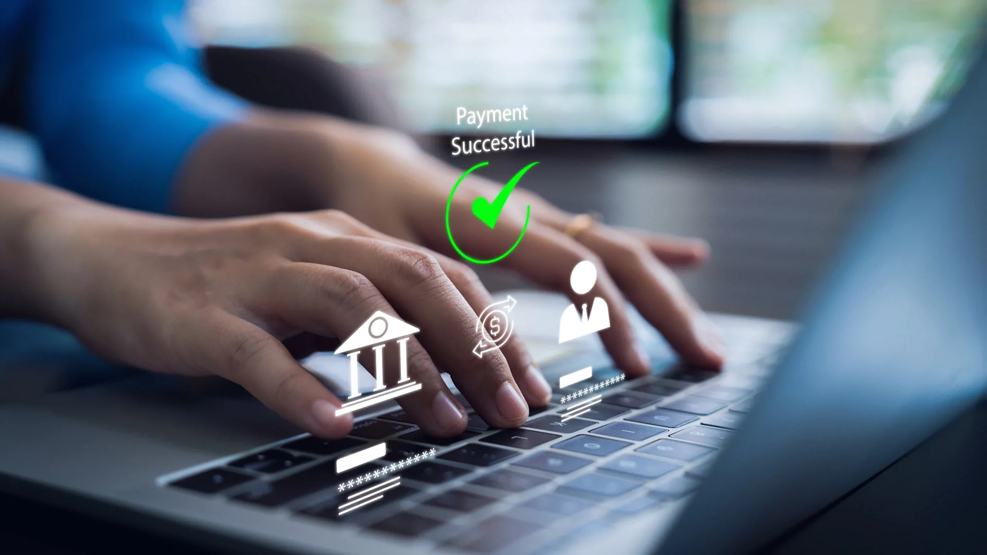 Hands over a laptop's keyboard and a message of Payment successful