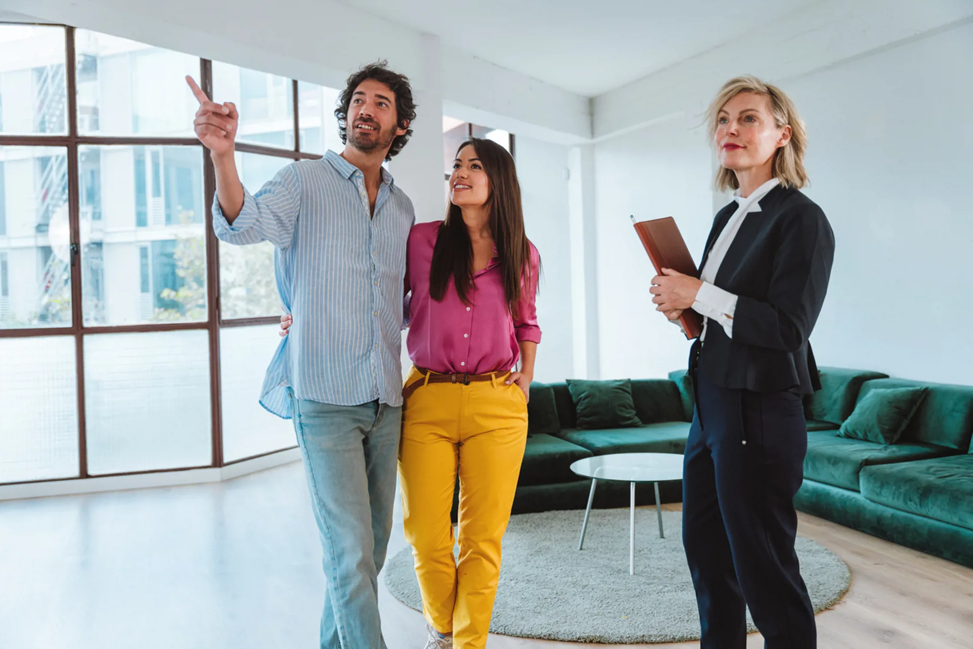 Real estate agent showing an apartment to a couple