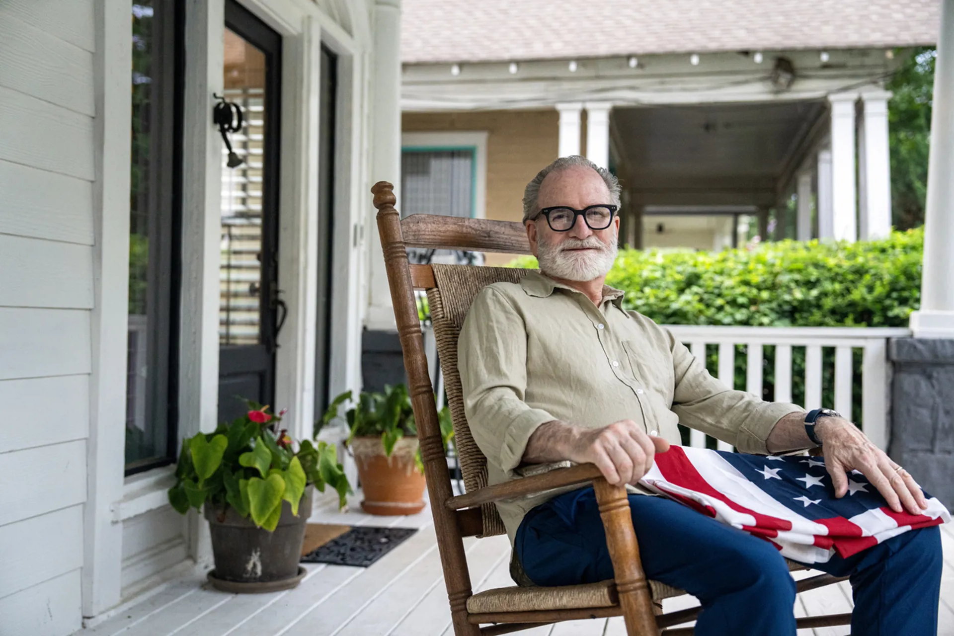 Retired Veteran sitting with a USA flag