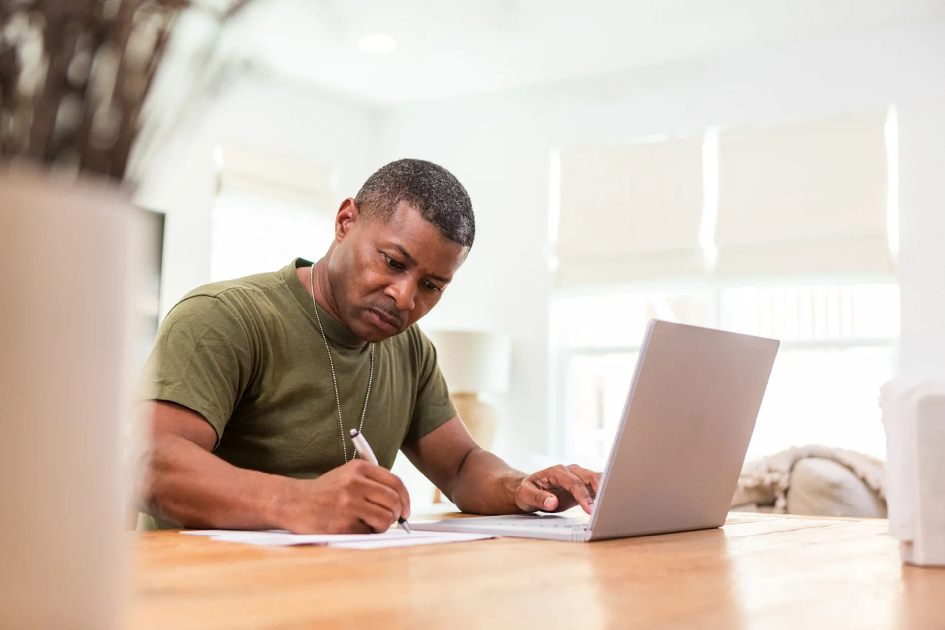 Serious soldier using the computer