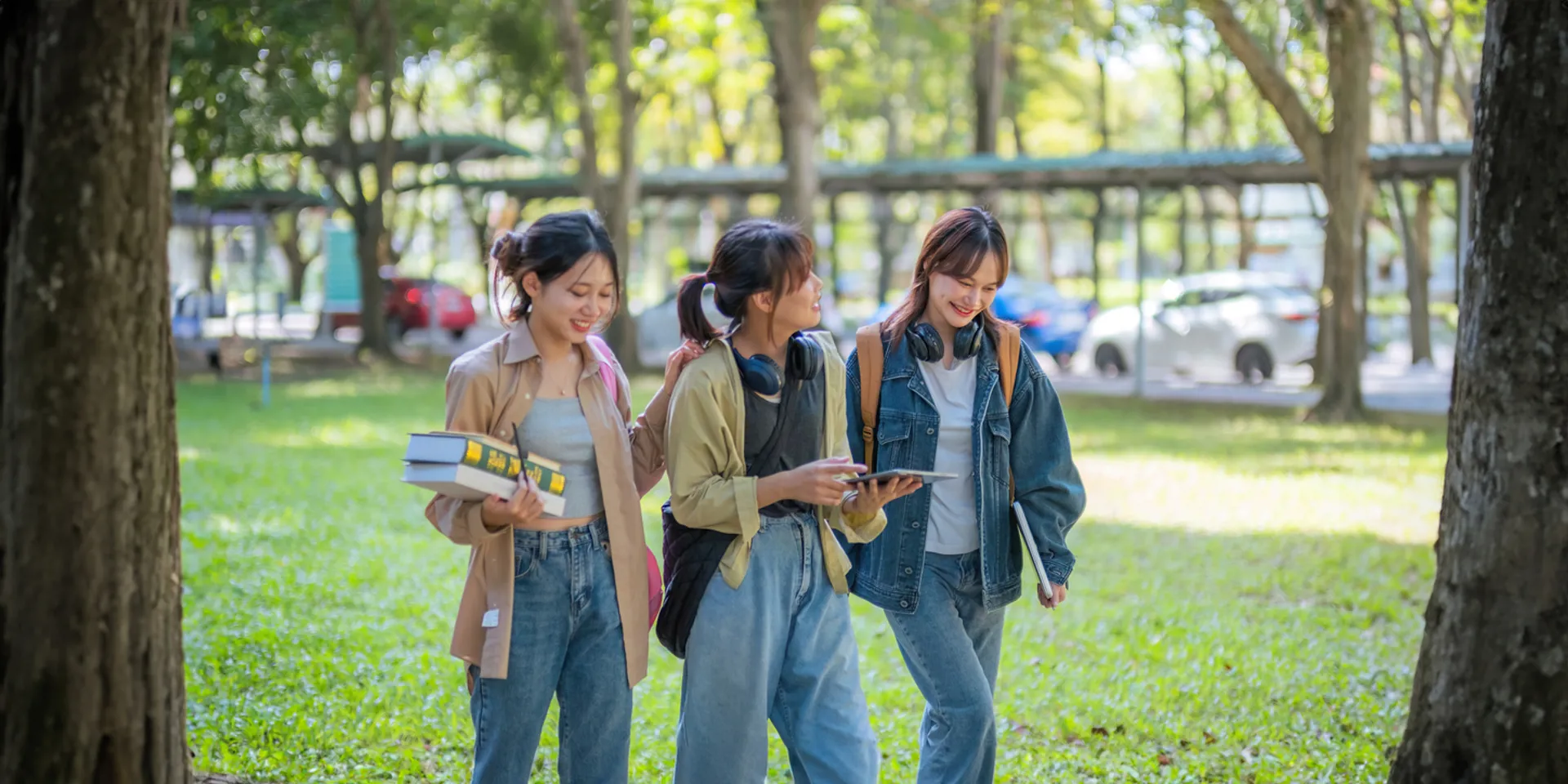 Student university friendship concept with classmate walking together at campus college park