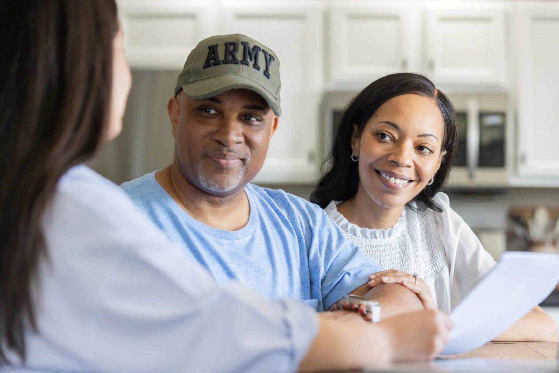 Veteran couple meeting with financial advisor