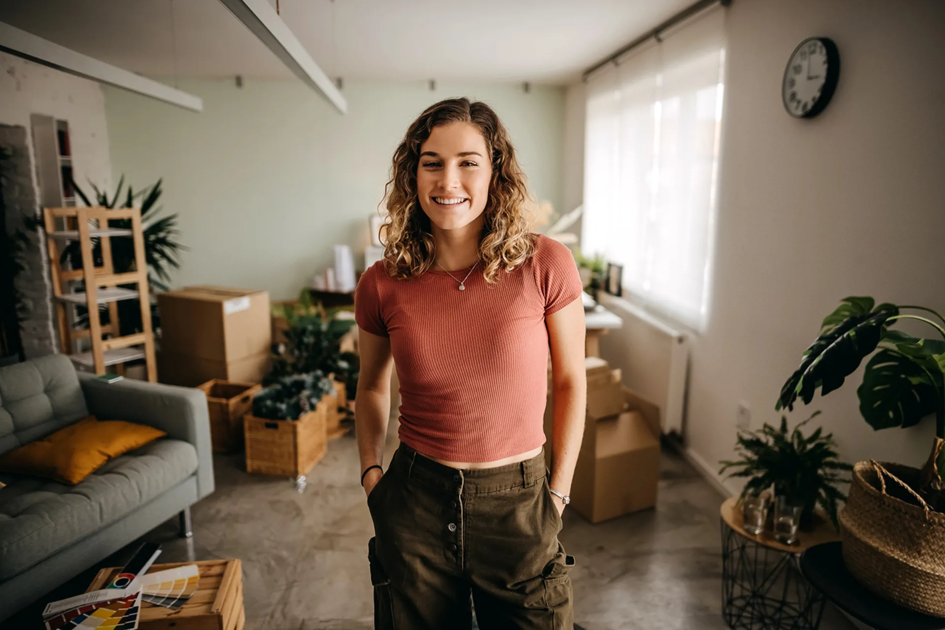 White blond woman smiling inside her house