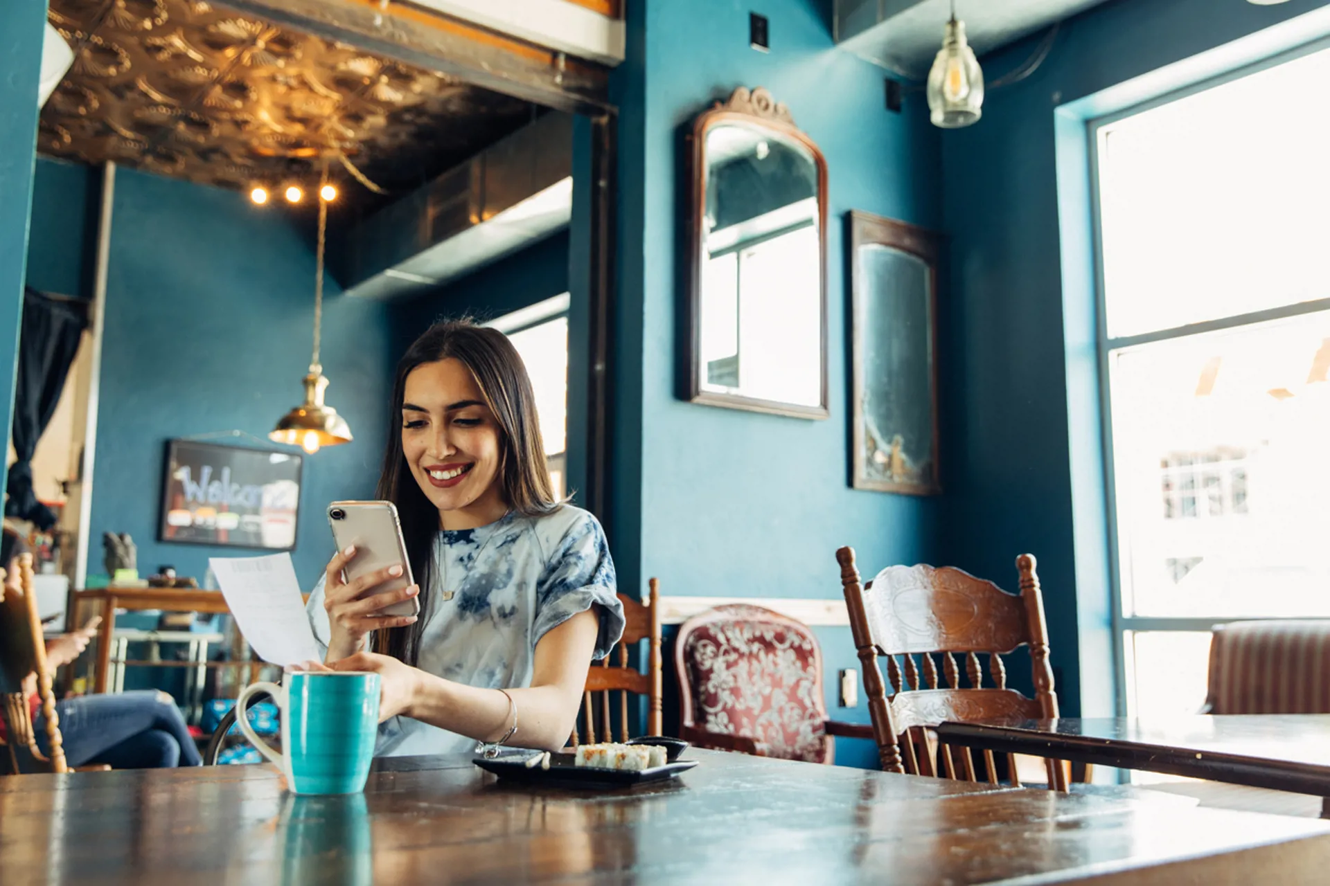 Woman Tracking Restaurant Bill