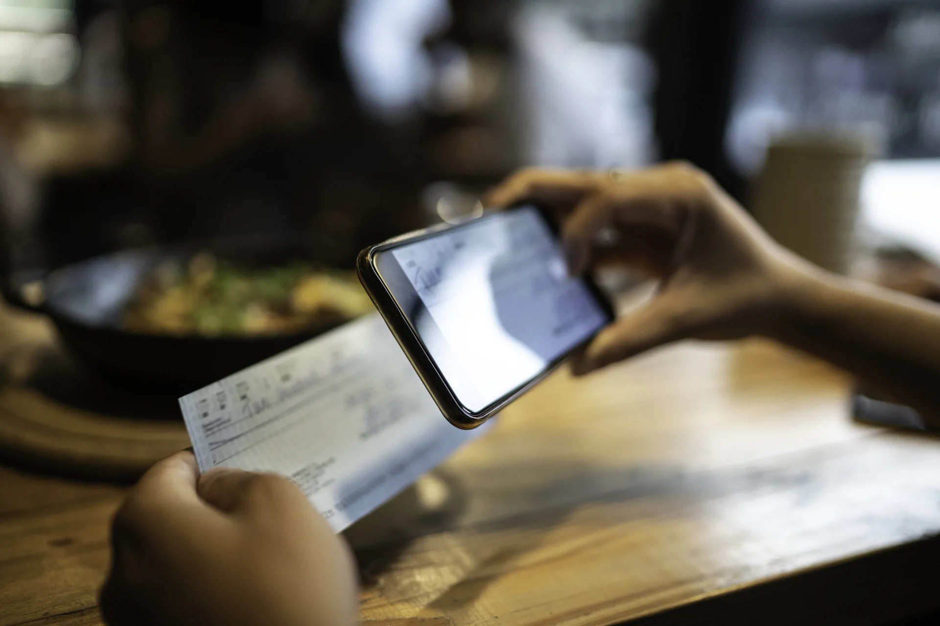 Image of person depositing check with mobile app