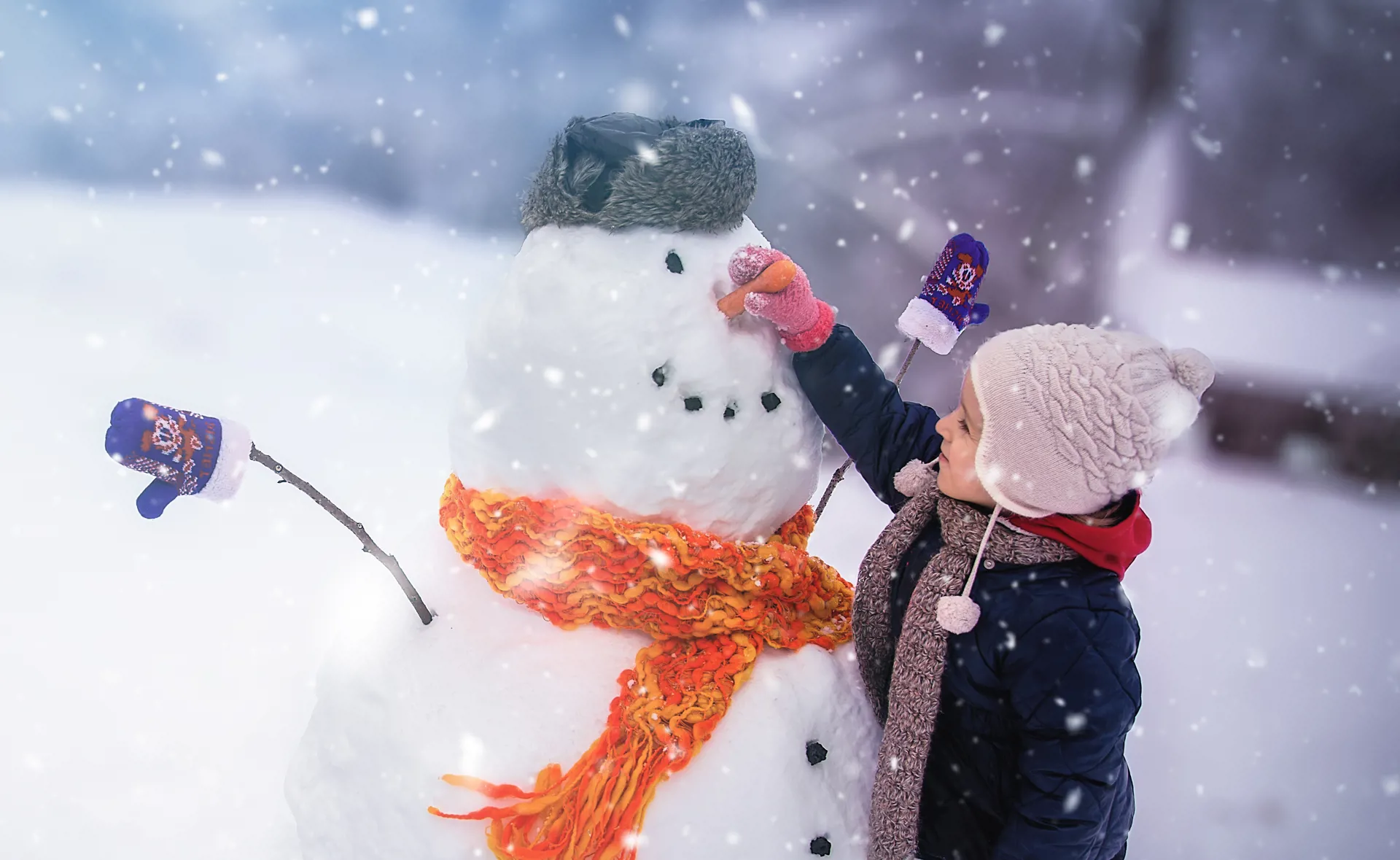 Happy child playing in snow