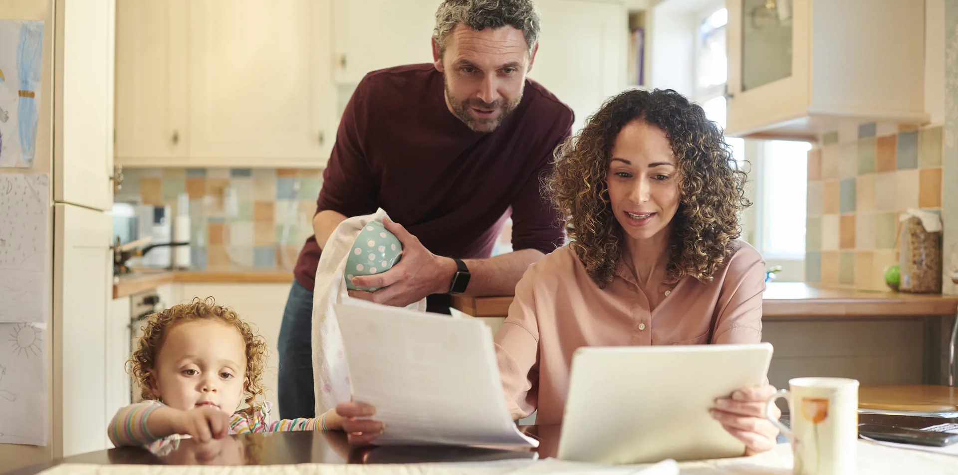 couple with child looking at finances