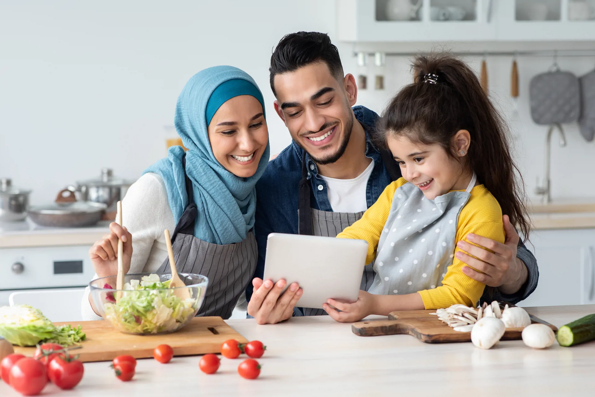 Islamic family at kitchen counter