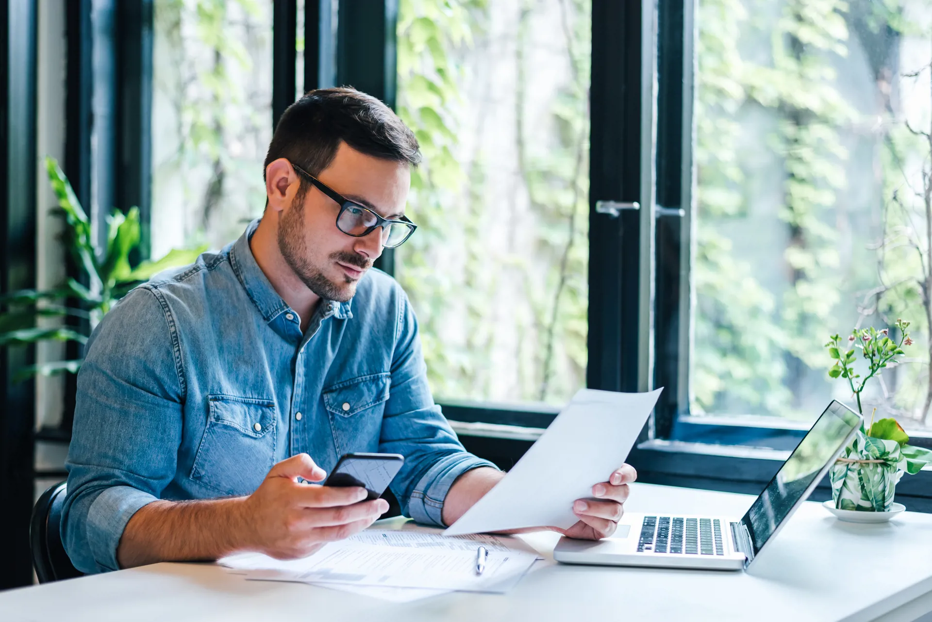 man looking at paperwork