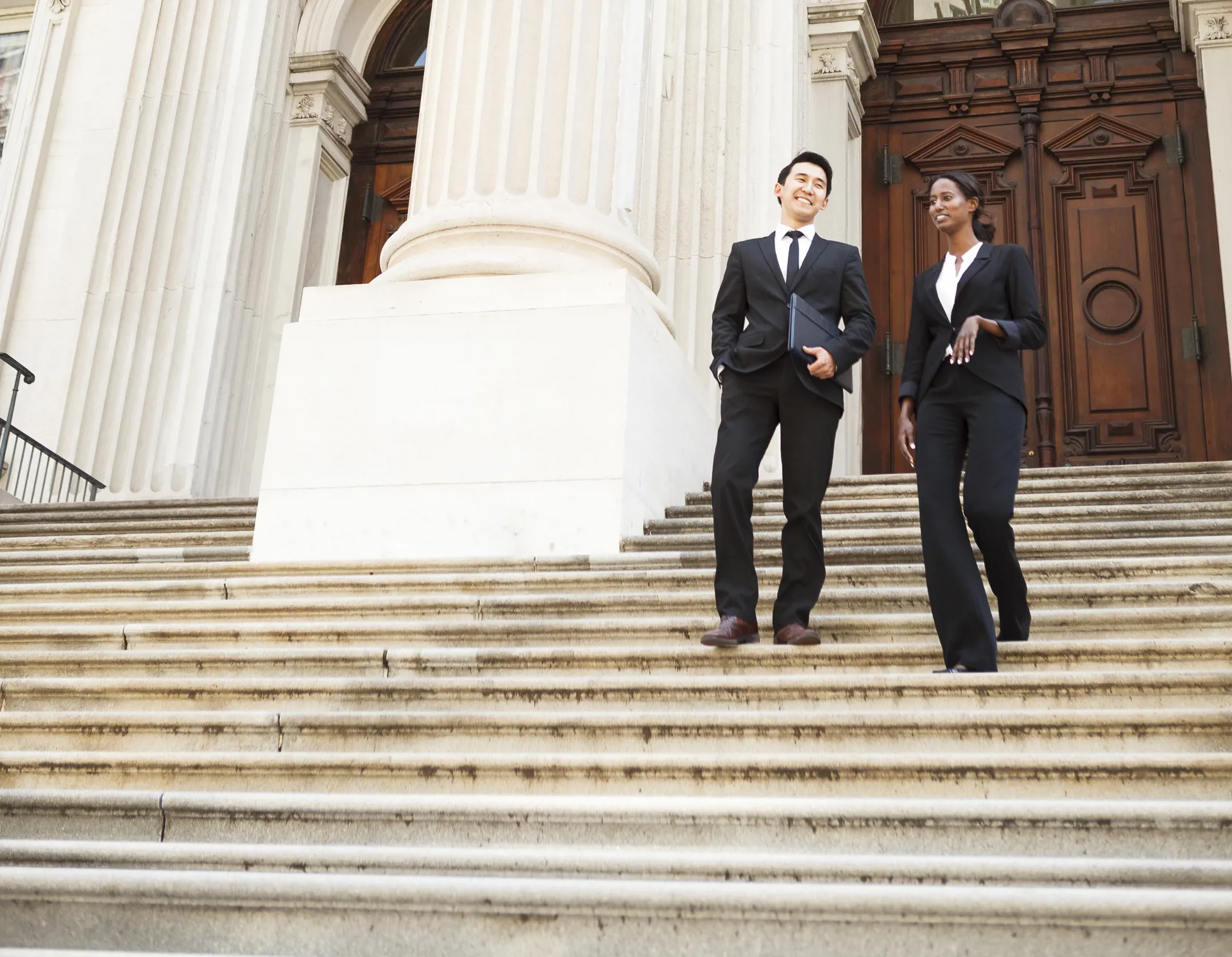 lawyers walking down stairs